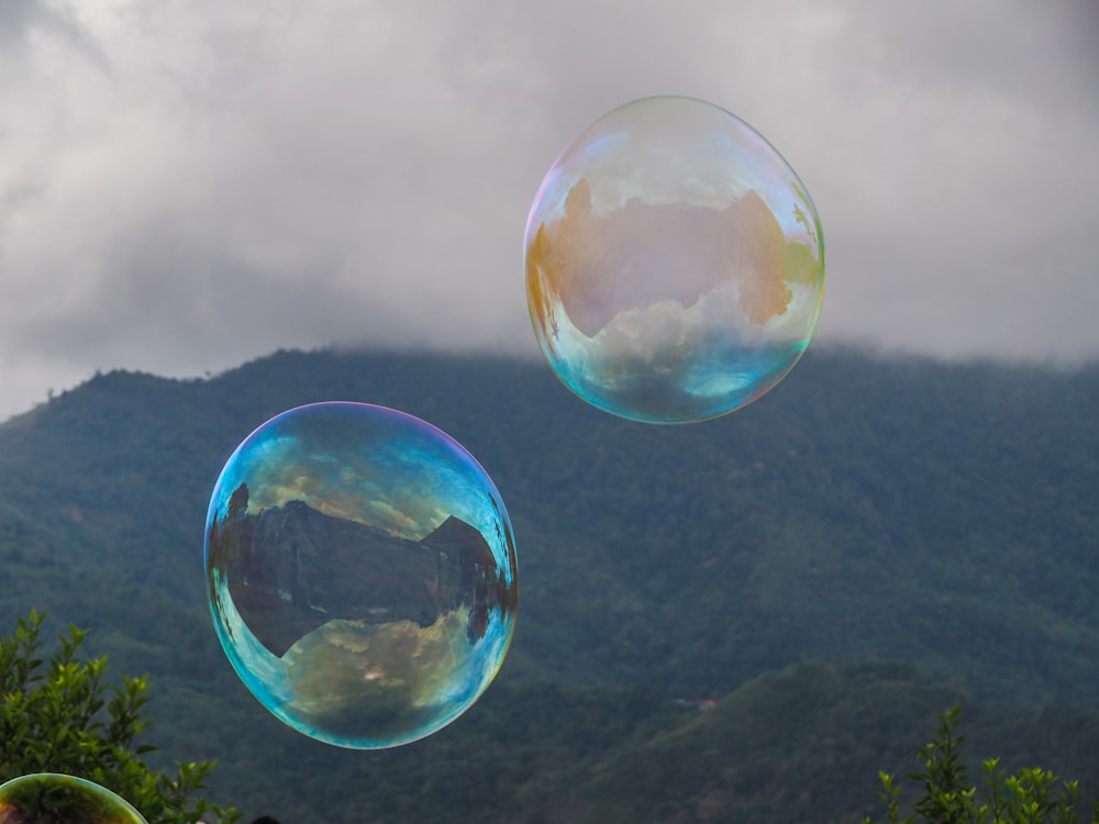 a couple of soap bubbles floating in the air