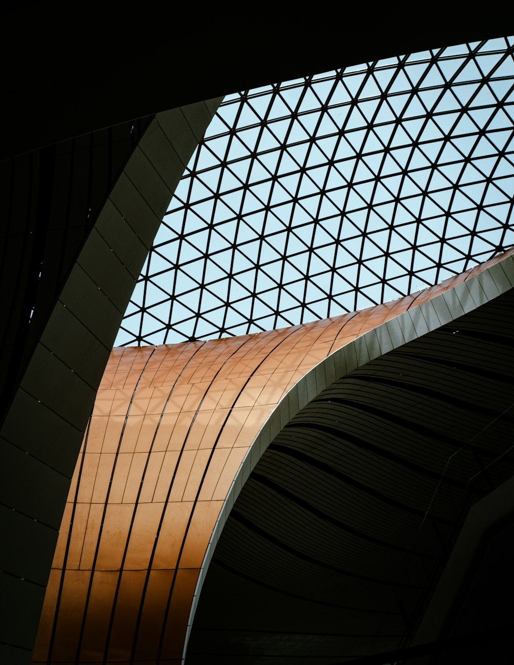 a view of the ceiling of a train station