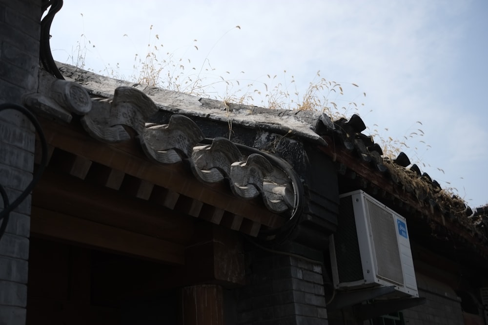 the roof of a building with a air conditioner on top of it