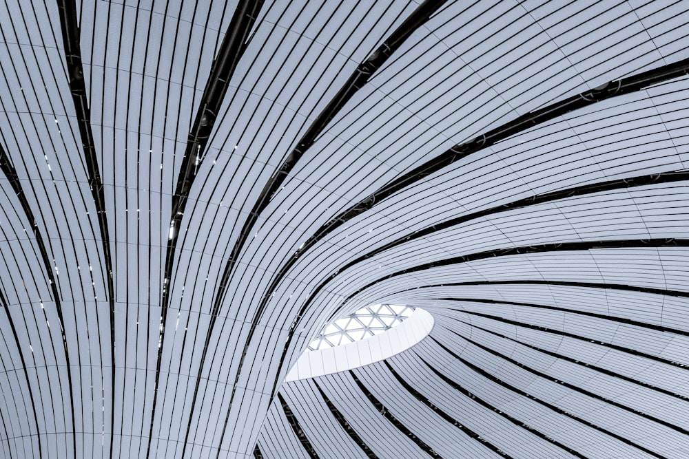 the ceiling of a train station with a clock on it