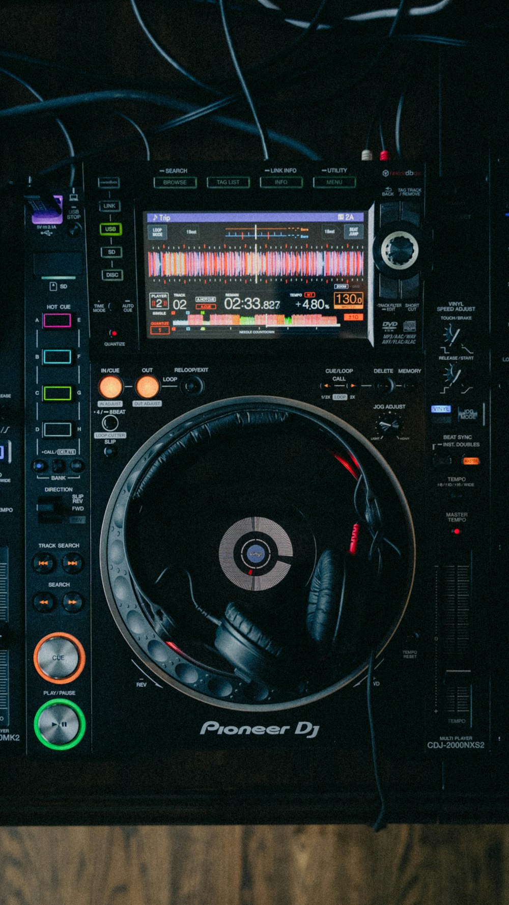 a pair of headphones sitting on top of a dj's turntable