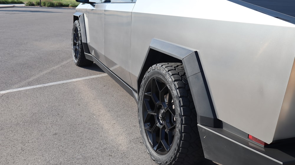 a silver car parked in a parking lot