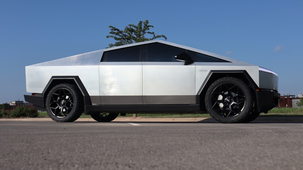 a futuristic car is parked on the side of the road