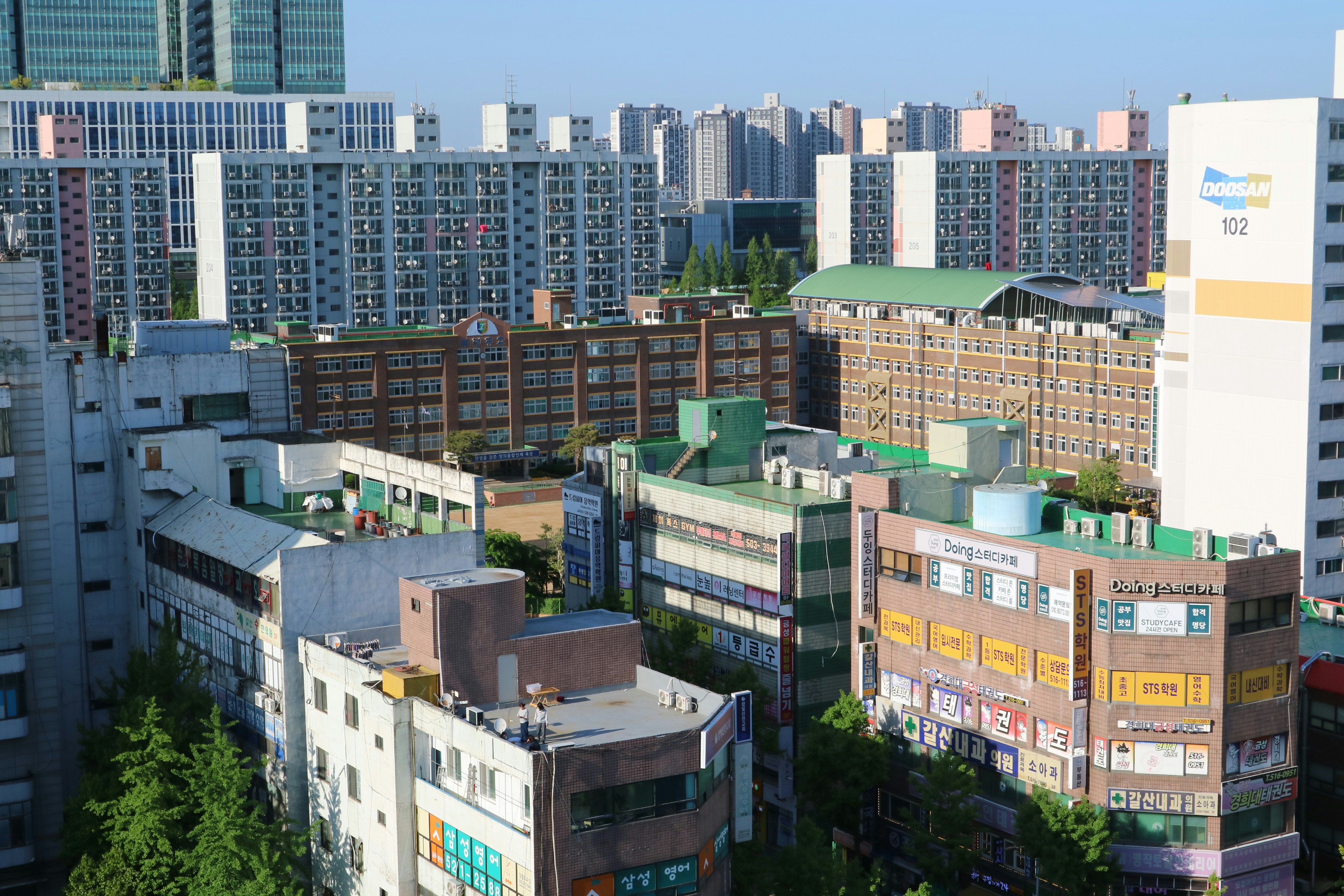 a city with lots of tall buildings and lots of trees