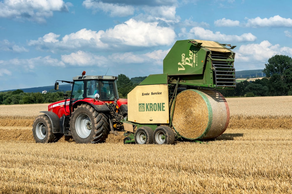 a tractor and a tractor trailer in a wheat field