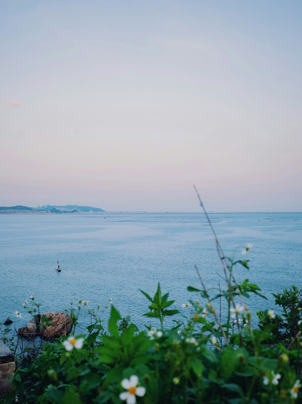 a body of water with a boat in the distance