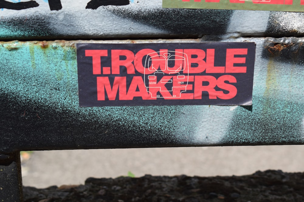 a sticker on a bench that says trouble makers