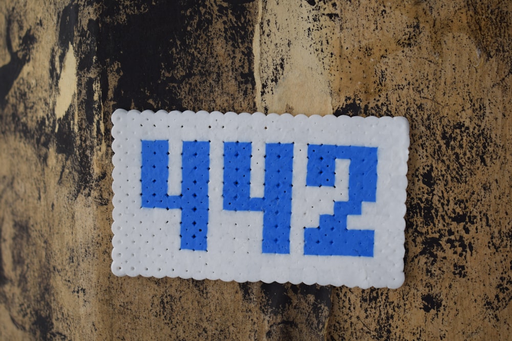 a sticker on the side of a building with the number 344 on it