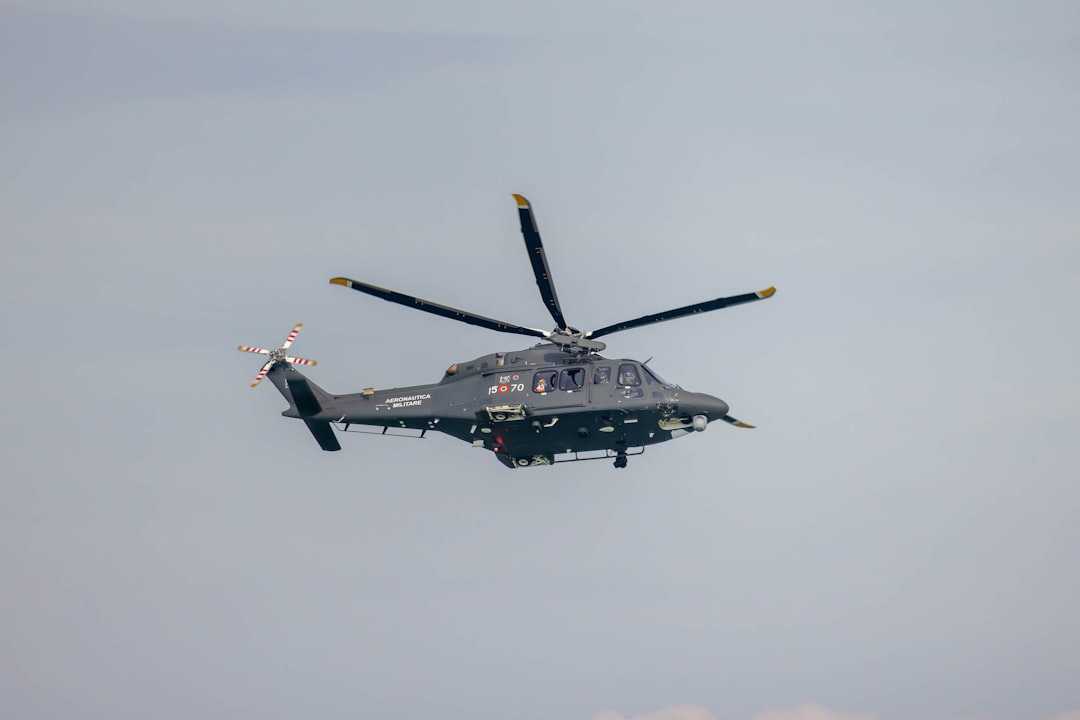 a helicopter flying in the sky with four propellers, AgustaWestland AW139 helicopter of the Italian Air Force during an 