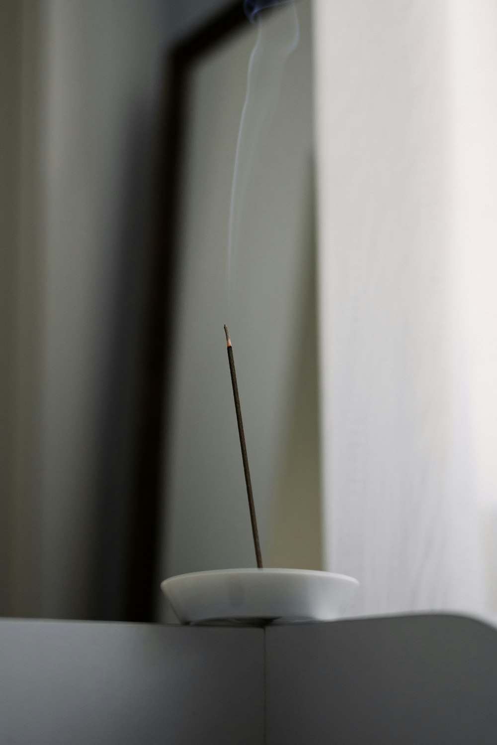a bowl with a match stick sticking out of it