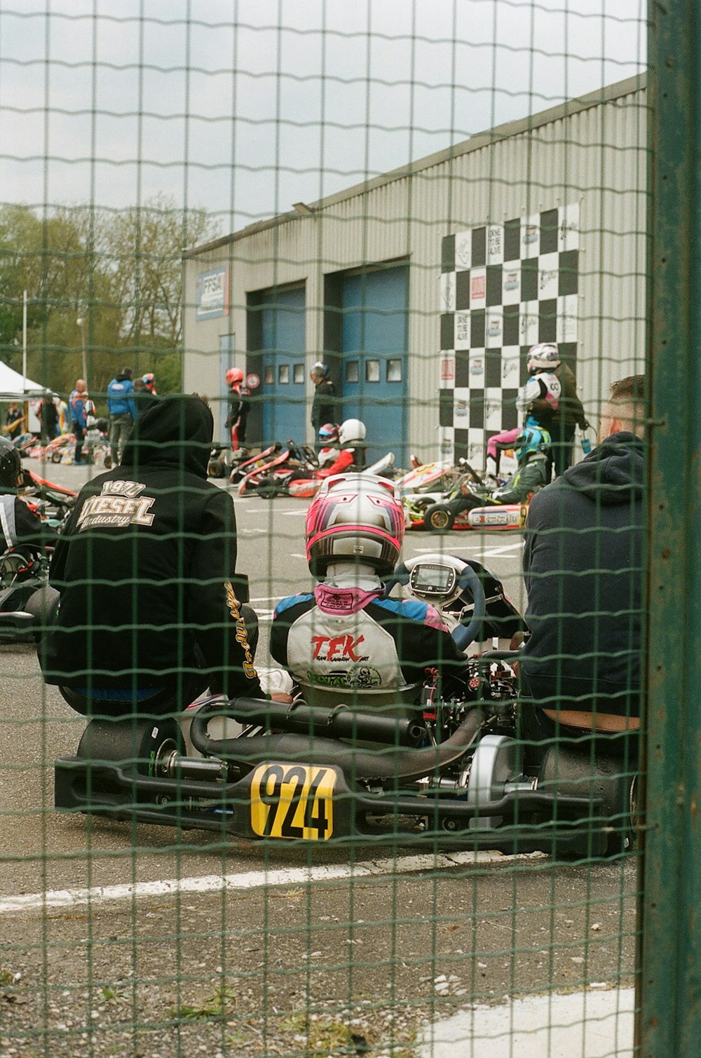 a group of people riding on the back of a motorcycle