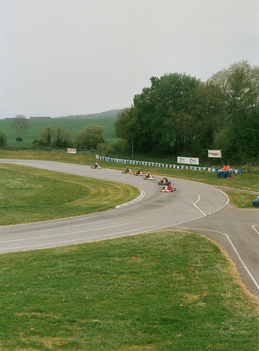 a group of people driving down a curvy road