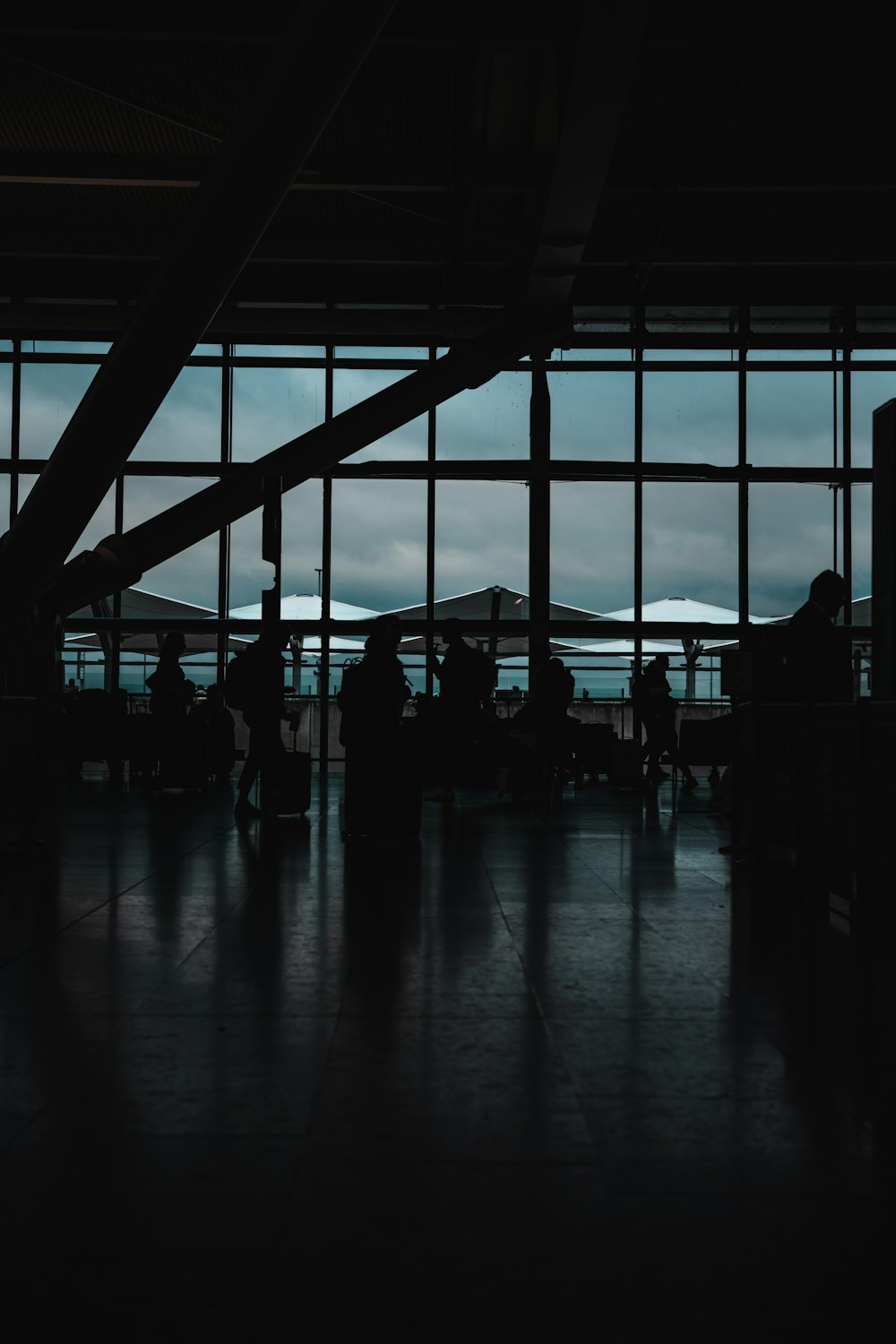 a group of people standing in front of a window