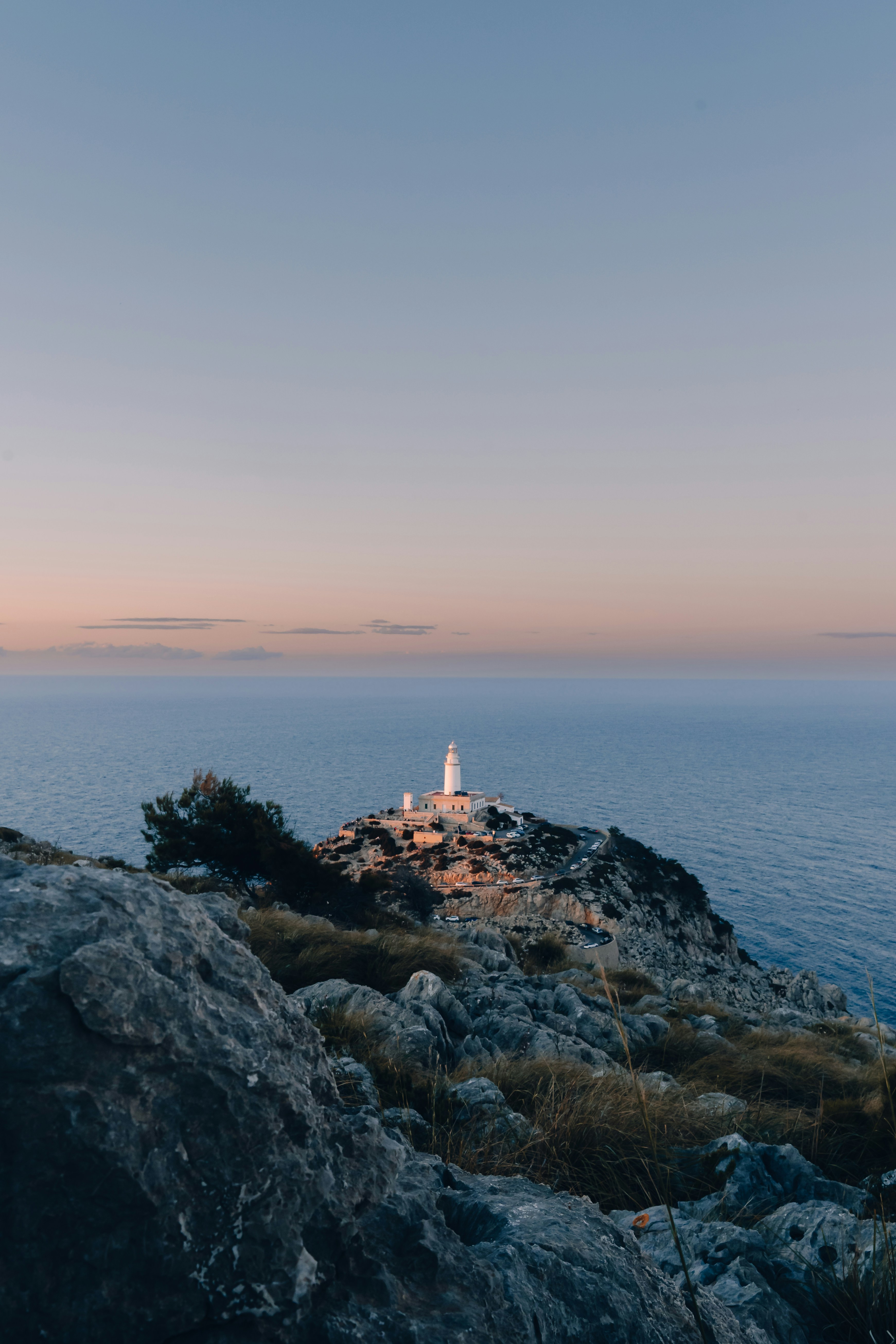 a light house sitting on top of a rocky cliff