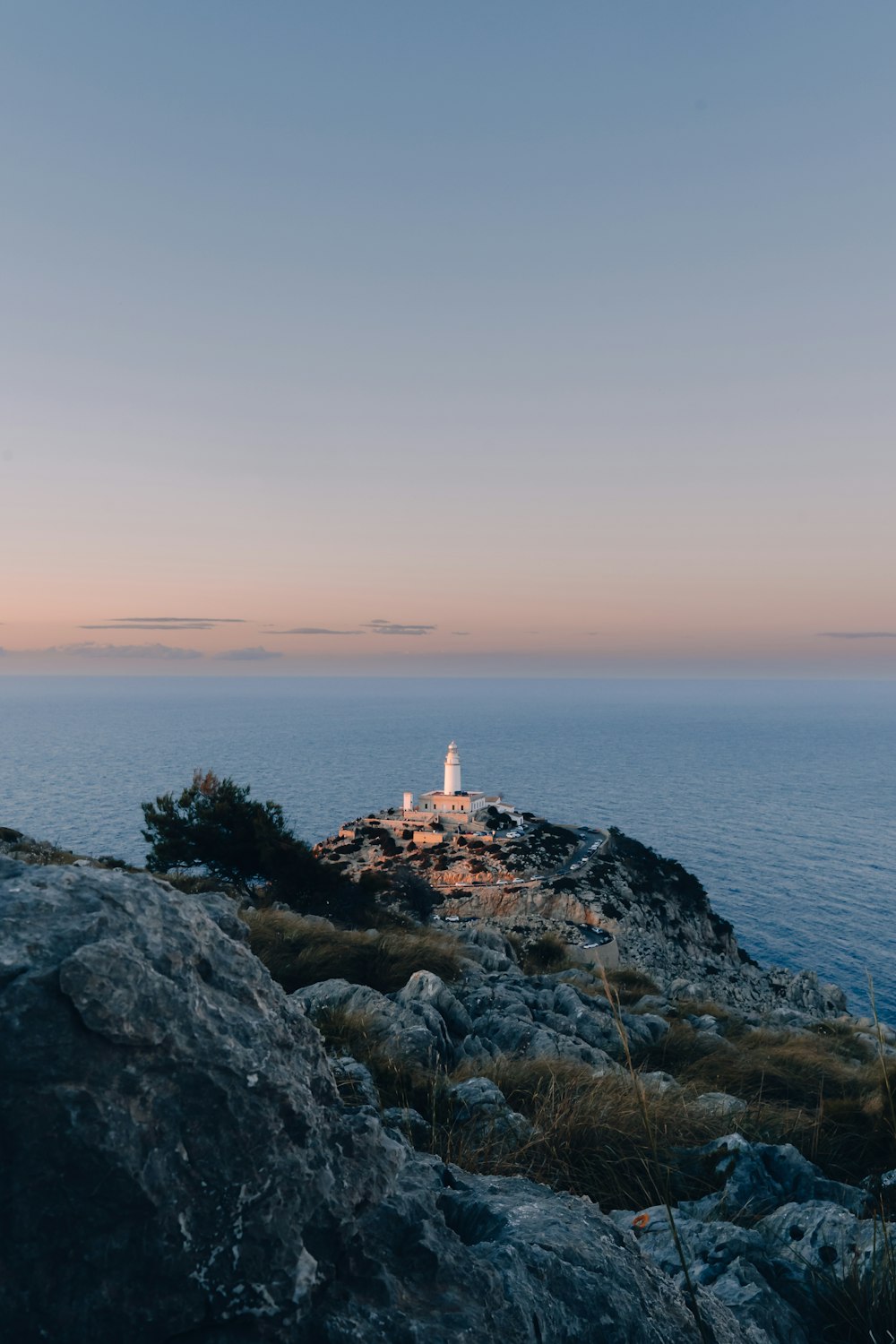 a light house sitting on top of a rocky cliff