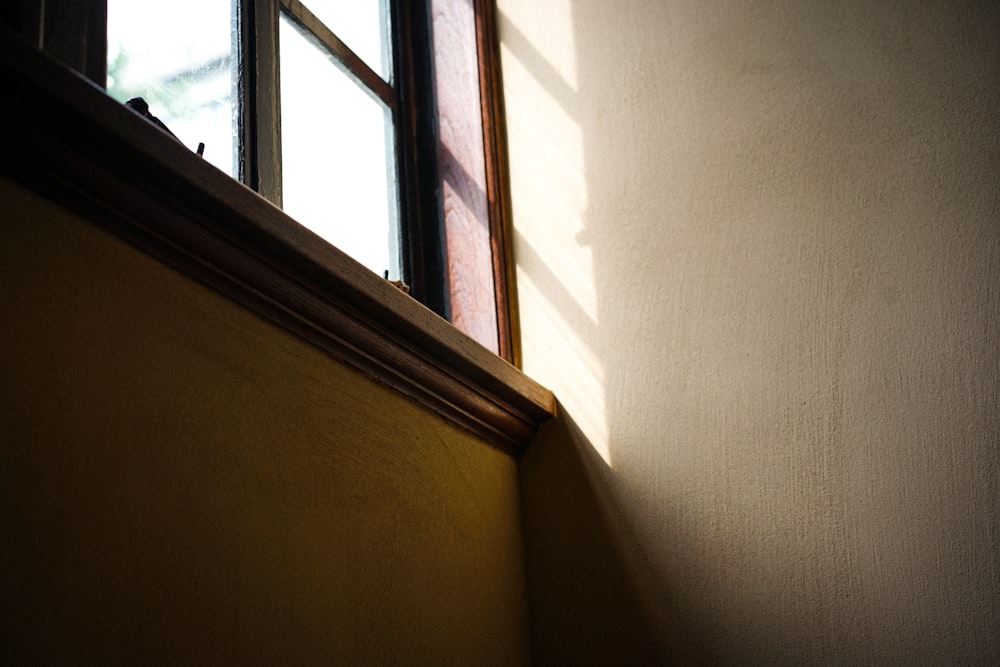 the shadow of a window on a wall