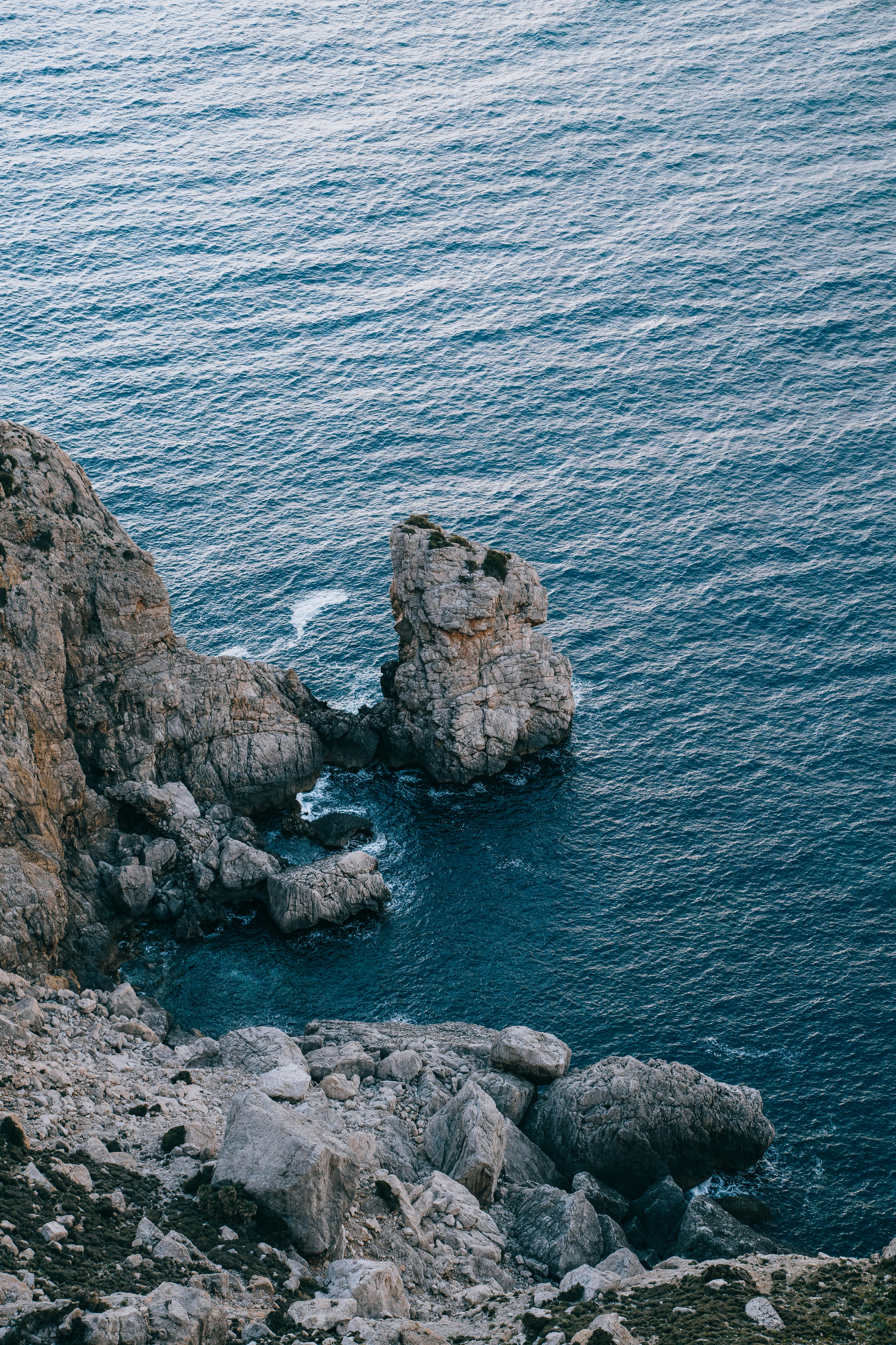 a couple of rocks that are in the water