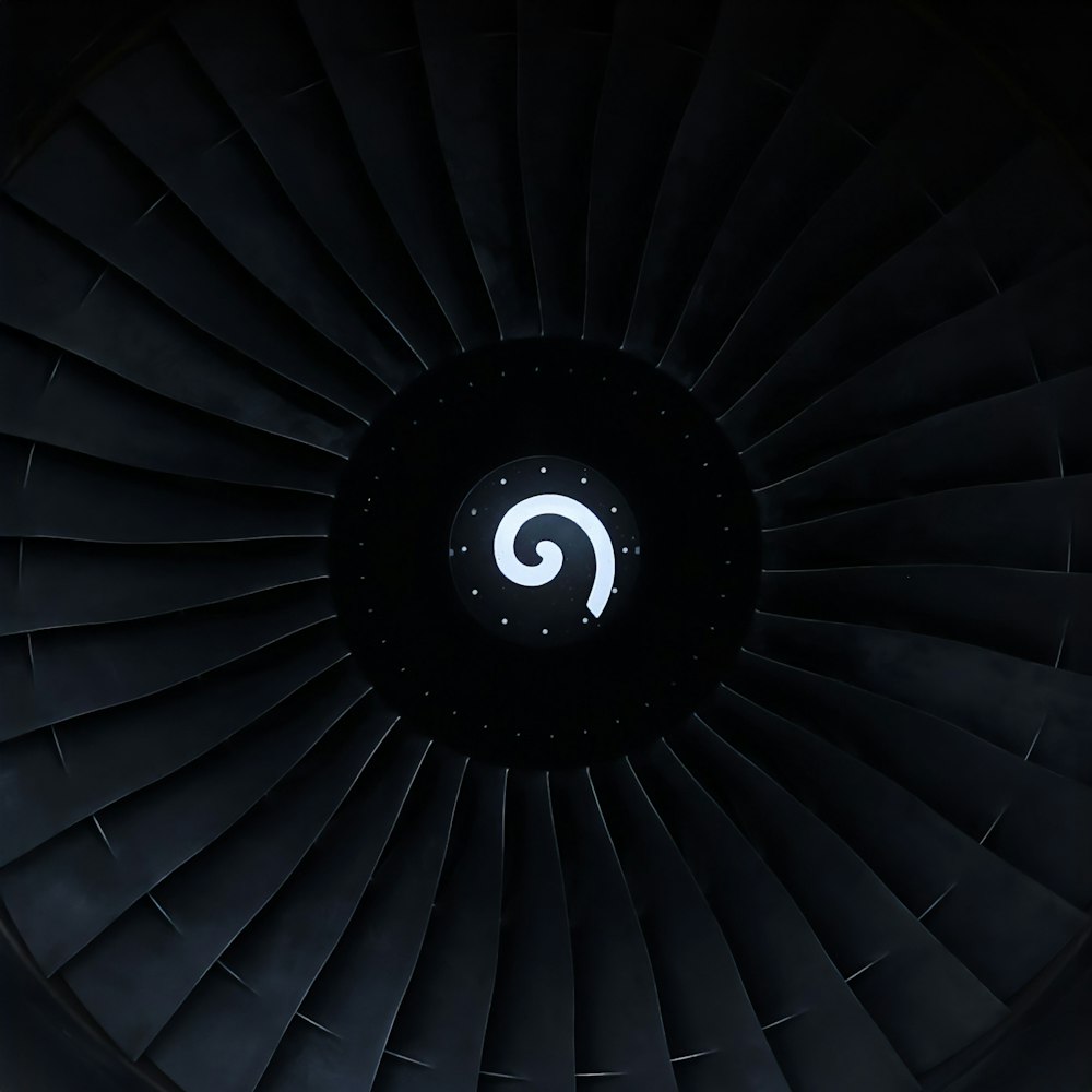 a close up of a jet engine in the dark