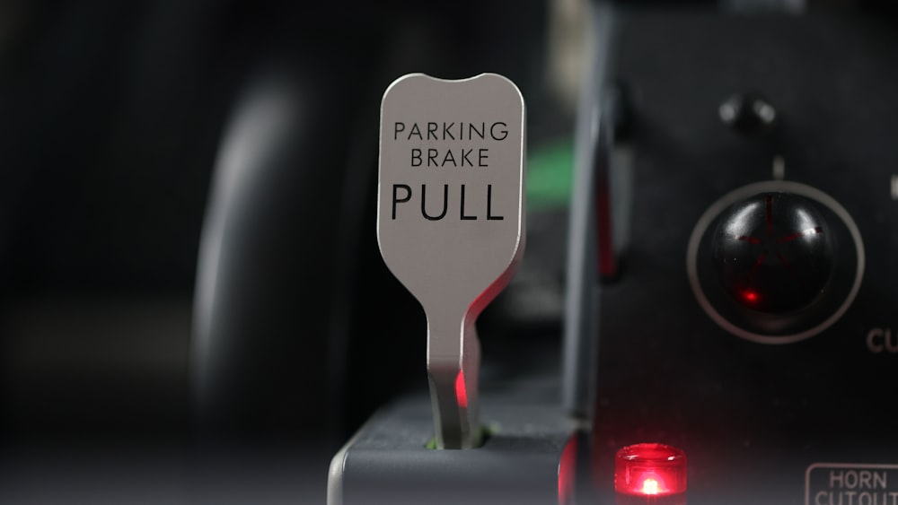 a parking brake pull sign with a red light