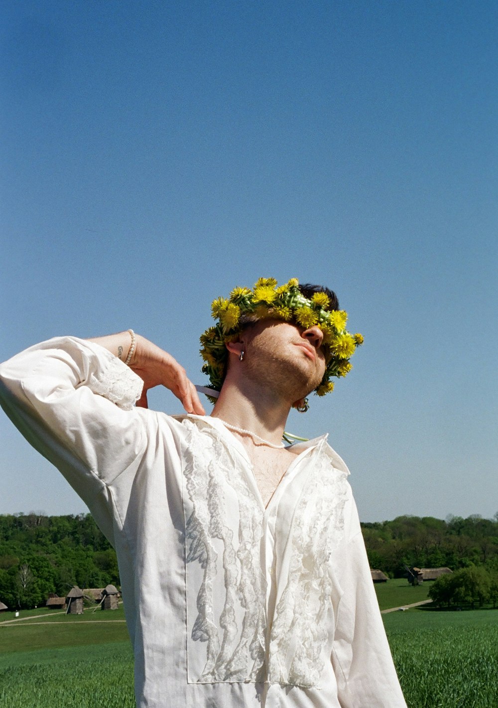 a man with a flower crown on his head