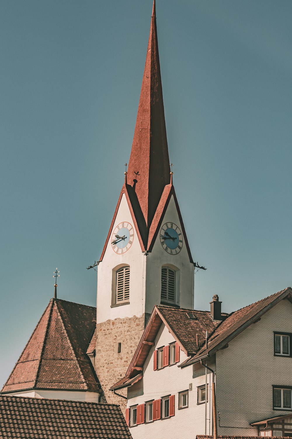 a church steeple with a clock on it