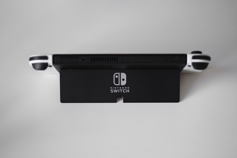 a nintendo switch sitting on top of a wall