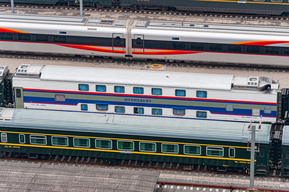 a train is traveling down the tracks next to another train