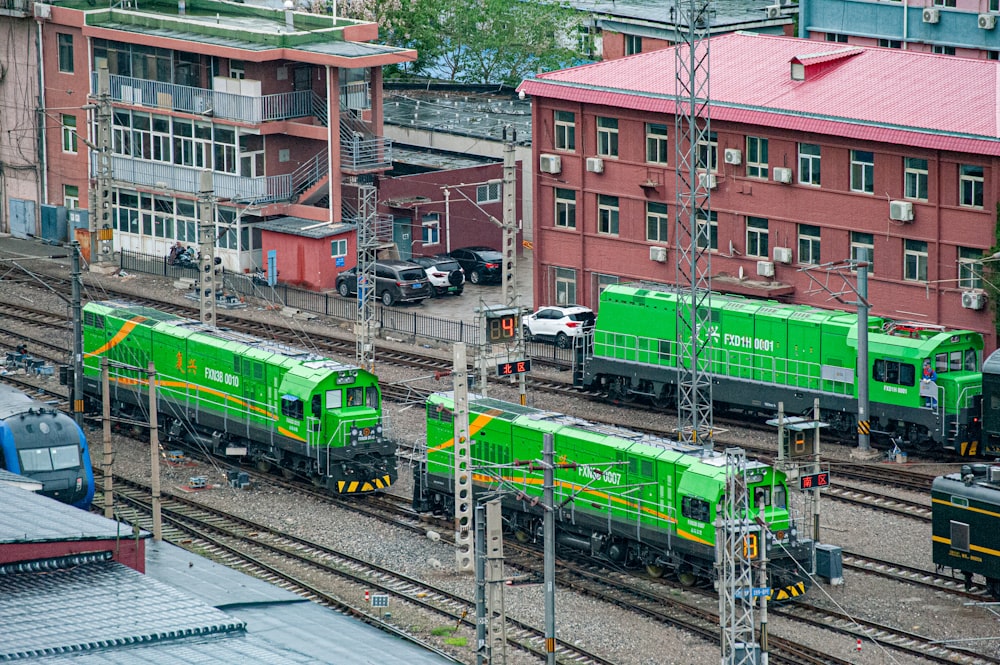 a train yard with several trains on the tracks