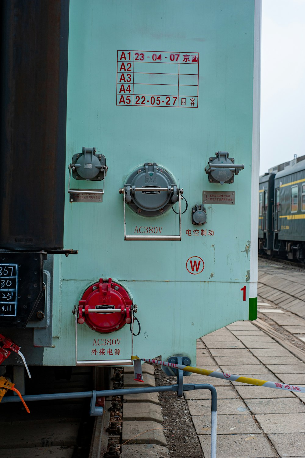 a train engine sitting next to a train station