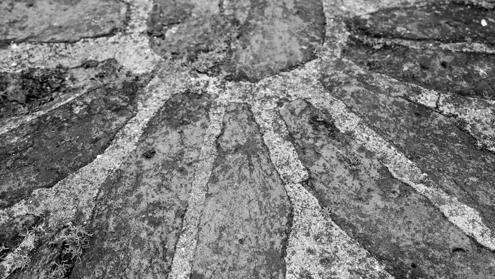 a black and white photo of a stone wall