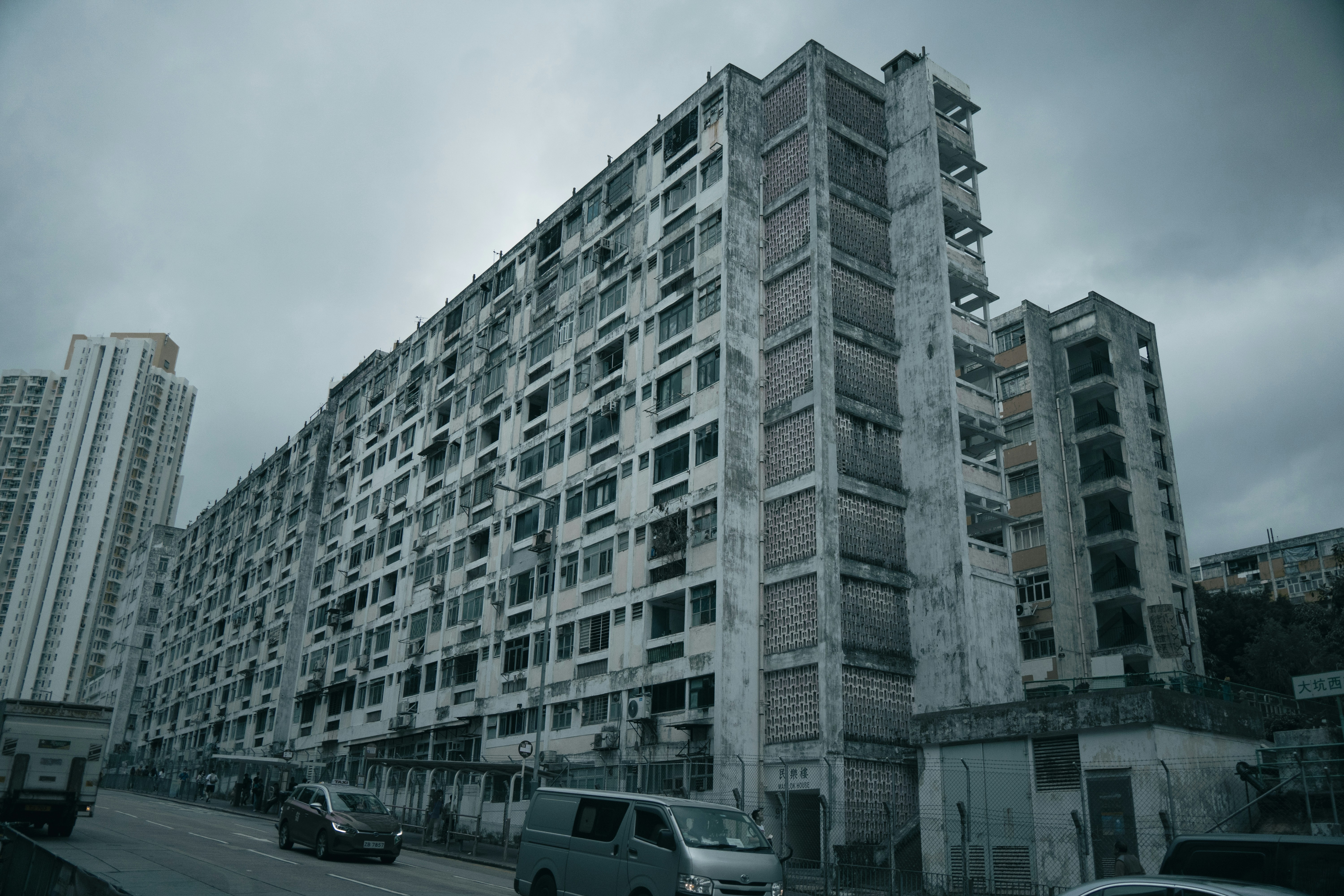 a very tall building sitting on the side of a road