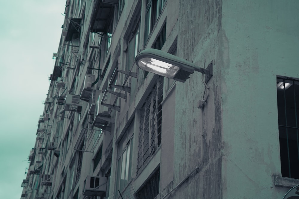 a street light on the side of a building