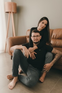 a man and a woman sitting on a couch