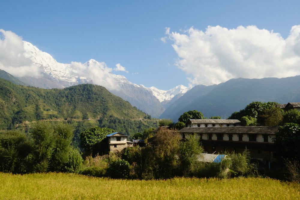 a view of a mountain range with a house in the foreground