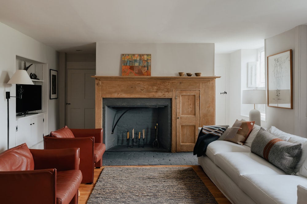 a living room filled with furniture and a fire place