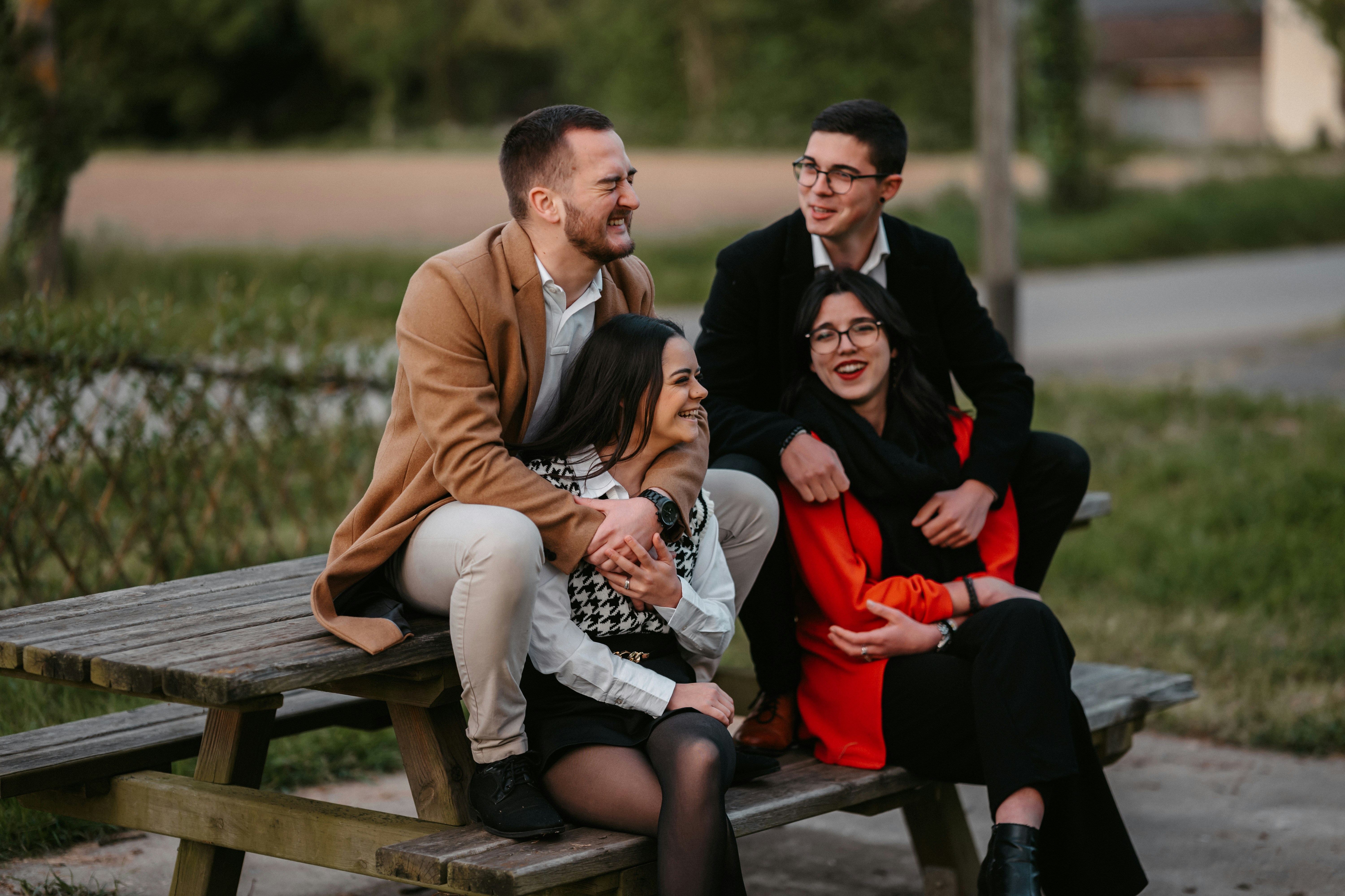 a group of people that are sitting on a bench