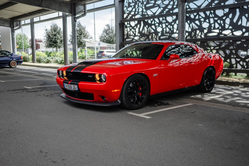 a red sports car parked in a parking lot