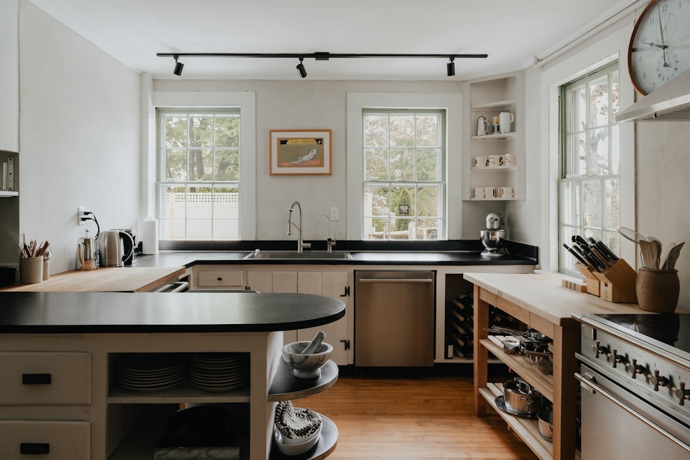 a kitchen with a clock on the wall