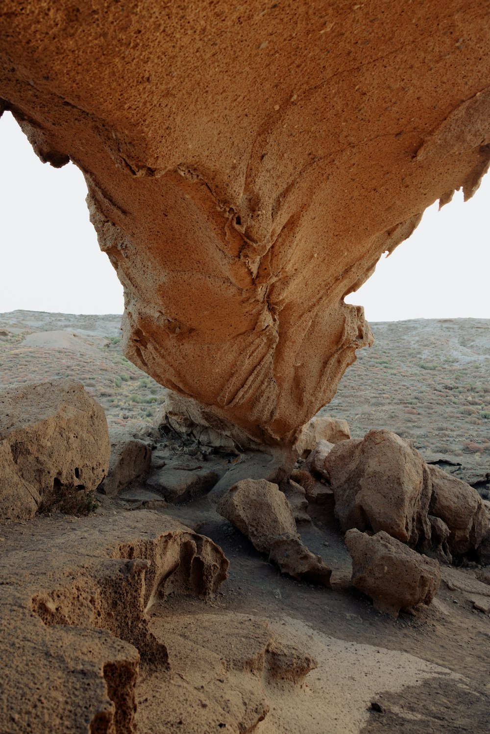 a rock formation in the middle of a desert