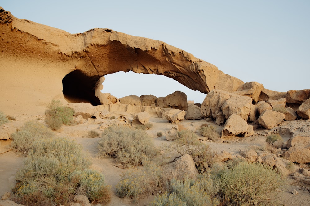 a rock formation with a cave in the middle of it