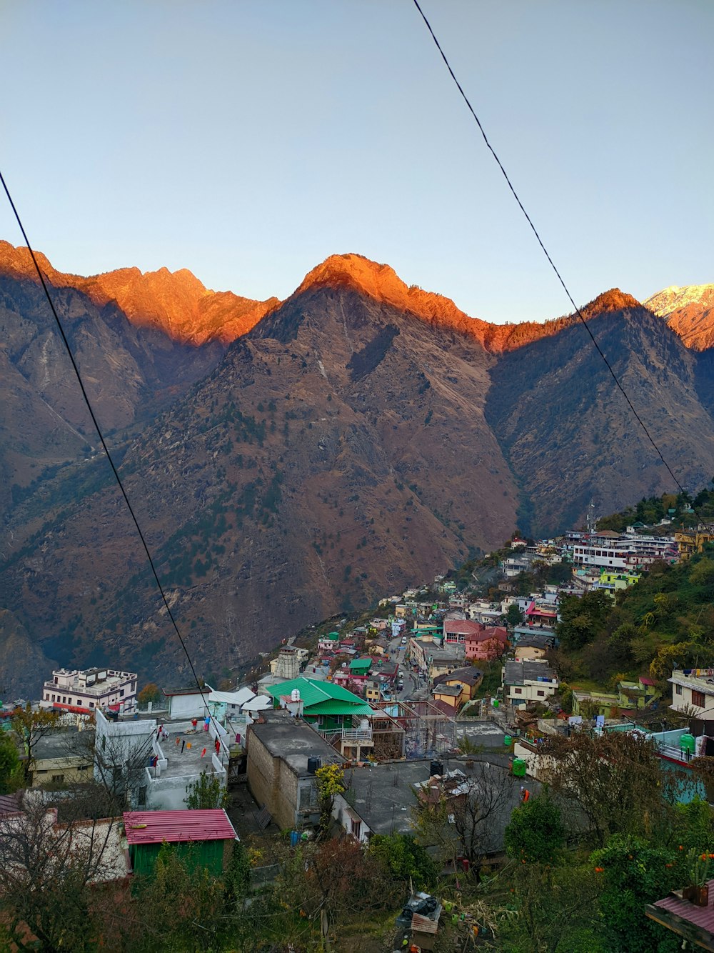 a view of a city with mountains in the background