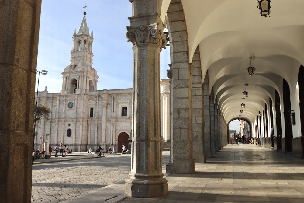 a large cathedral with a clock tower in the background