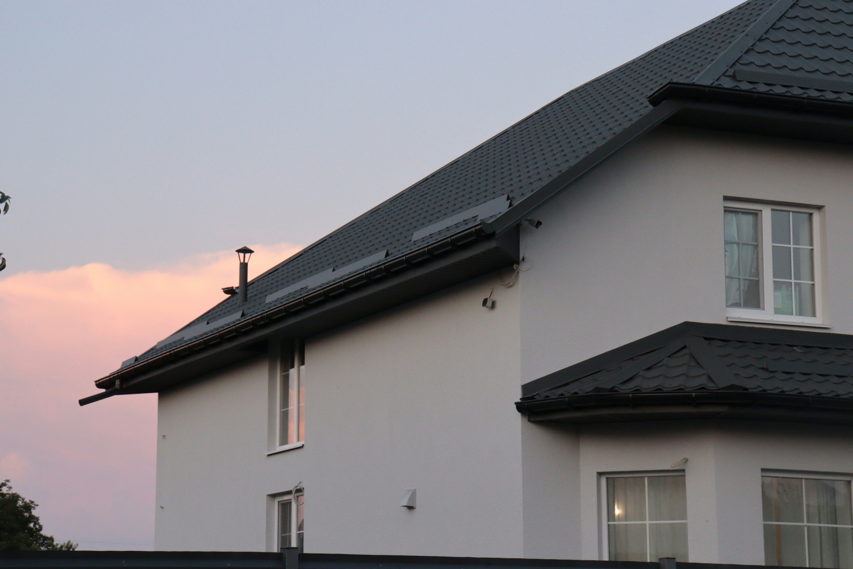 a house with a solar panel on the roof