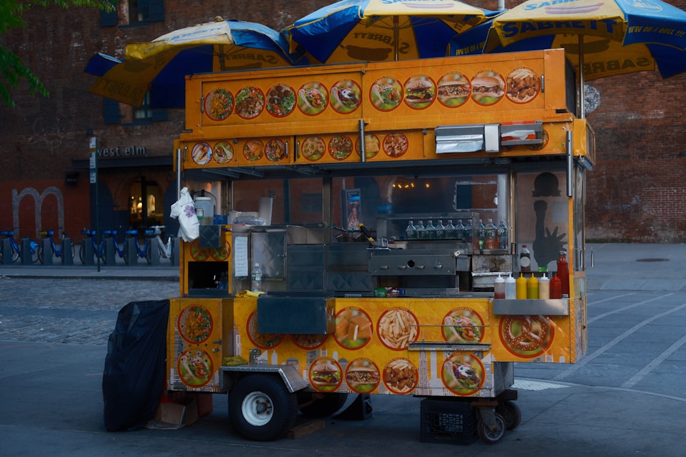 a food cart is parked on the side of the road