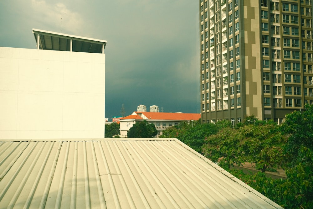 a tall white building sitting next to a tall white building