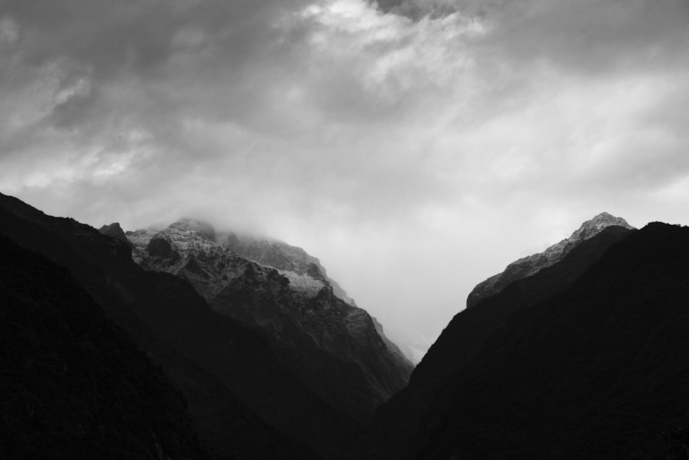 a black and white photo of a mountain range