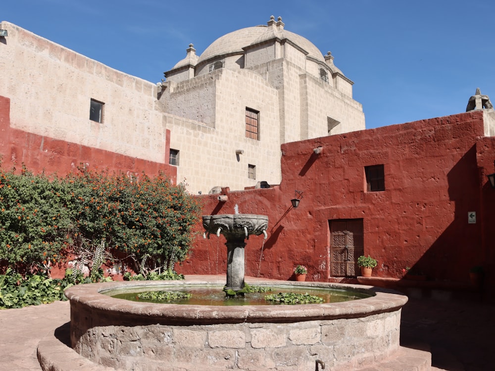 a building with a fountain in front of it