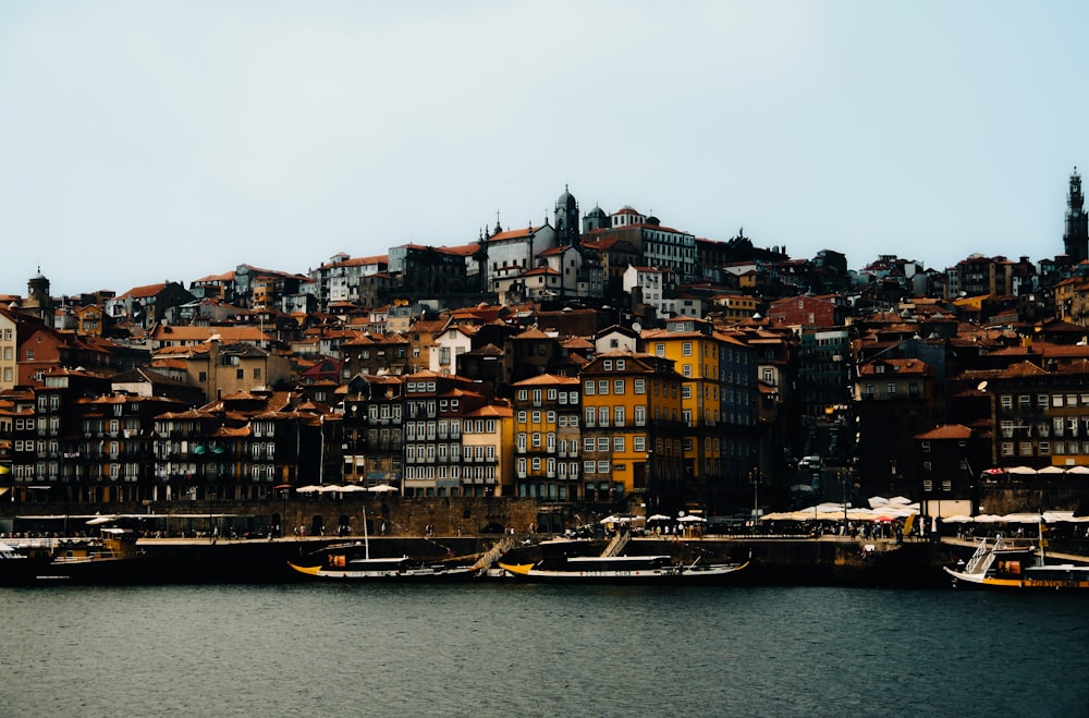 a group of boats floating on top of a body of water