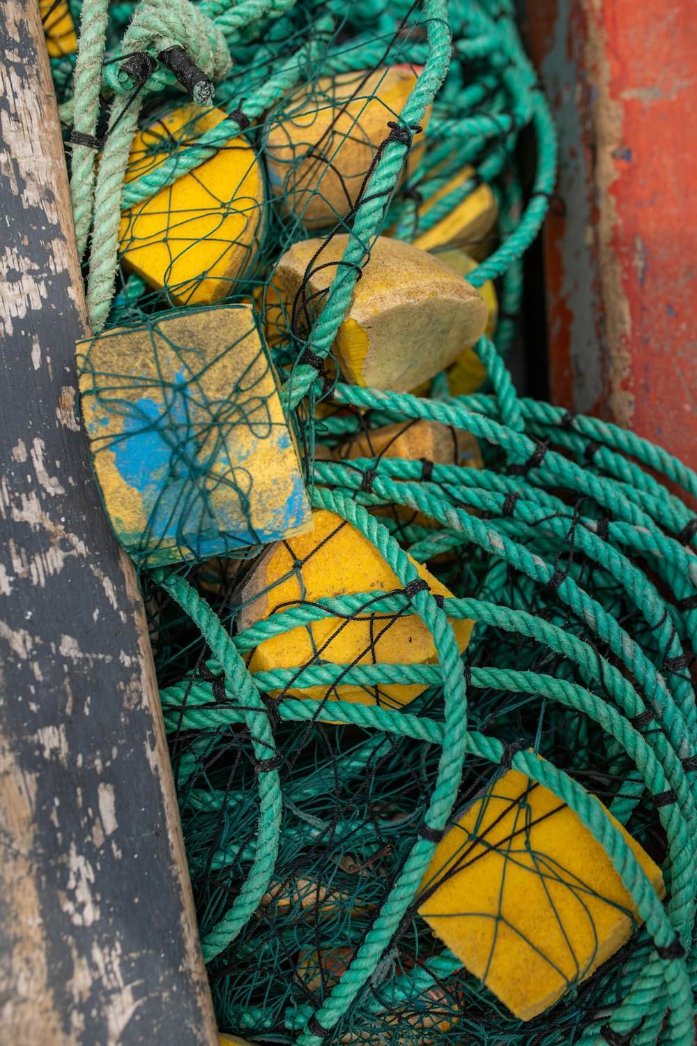 a pile of green and yellow fishing nets