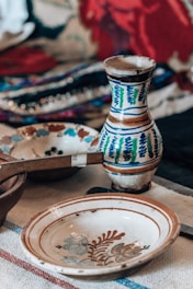 a table topped with plates and bowls on top of a table